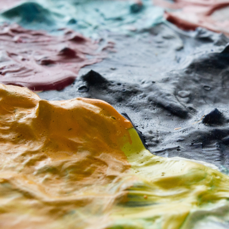zoomed in on dried thick paint which appears raised and lumpy.